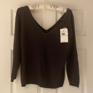 Nicole Miller grey sweater with v- neck in front and back and delicate beading.